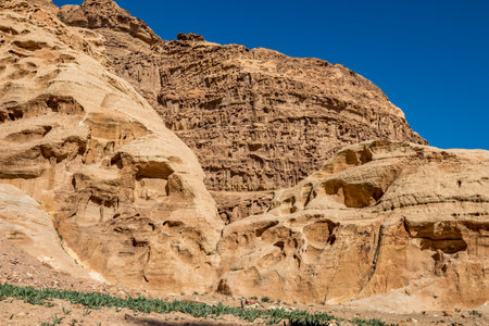 Cliff formations. I have enjoyed the amazing views from the scenery Monastery Route, beautiful sunny day at Petra complex and tourist attraction, Hashemite Kingdom of Jordanの写真素材
