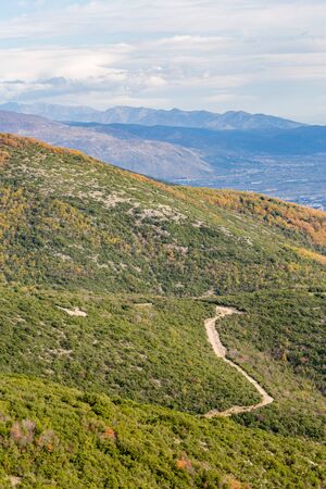 Curvy mountain empty road, Xanthi region, Northern Greece. High angle view, late autumn hazy day, travel photographyの写真素材