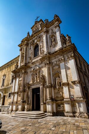 Amazing church of St. Maria, Mesagne, Puglia, Italy. Portrait mode view, clear blue sky, hot summer day, travel photographyの写真素材