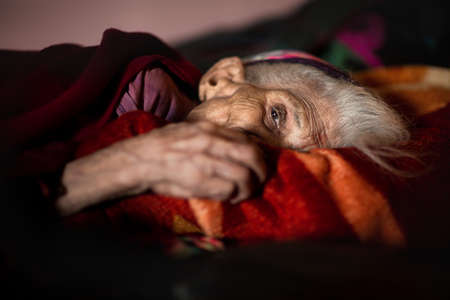 Uttrakhand, India - 05 November, 2019: A 98 old beautiful women, relaxing on her bedのeditorial素材