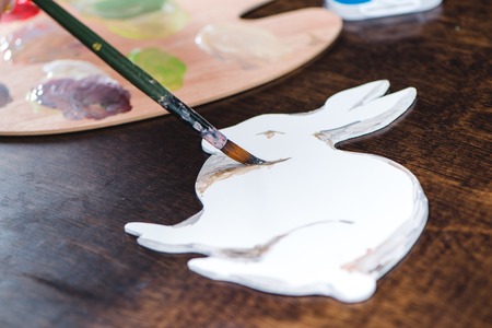 Close-up view of child painting animal on paperの写真素材