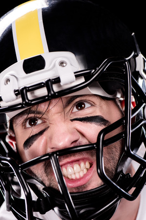 angry man american football player in helmet looking awayの写真素材