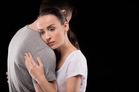 portrait of pensive woman bonding to man and looking awayの写真素材