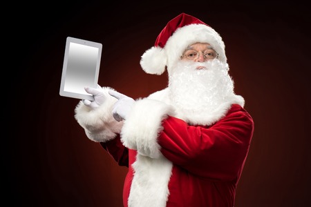 Santa Claus with digital tabletの写真素材