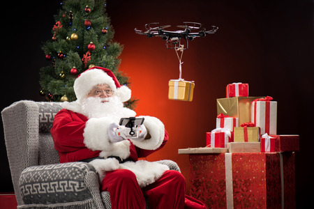 Santa Claus using droneの写真素材