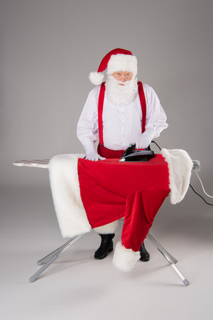 Santa Claus ironing coatの写真素材