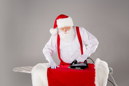 Santa Claus ironing coatの写真素材
