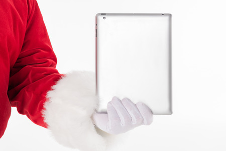 Santa Claus hand showing digital tabletの写真素材