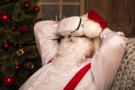 Santa Claus wearing virtual reality headsetの写真素材