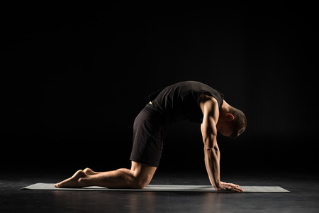 Man standing in yoga positionの写真素材
