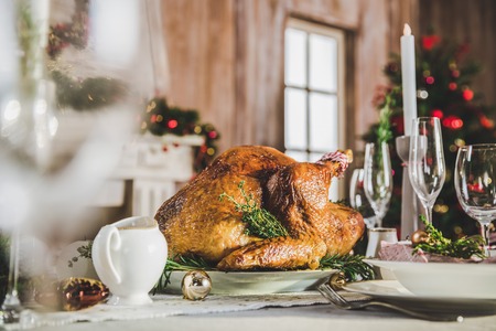 Roasted turkey on holiday tableの写真素材