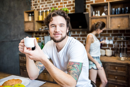Smiling man drinking coffee Smiling man drinking coffee