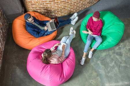 People in bean bag chairsの写真素材