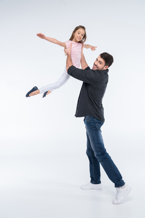 ocheerful father playing with daughterの写真素材