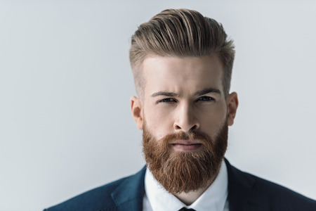portrait of handsome bearded businessman looking at cameraの写真素材