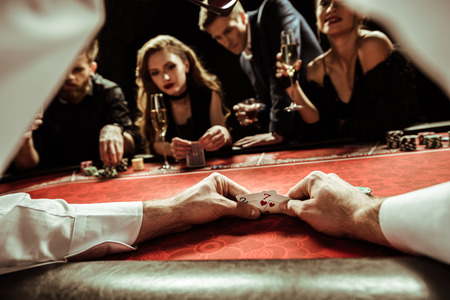 dealer shuffling cards in hands