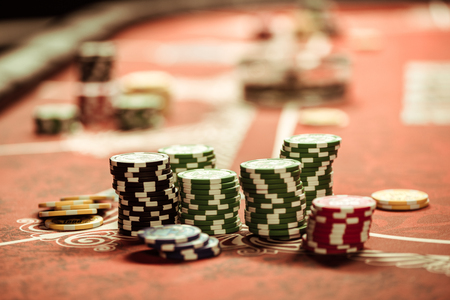 close up view of poker chips on table in casino