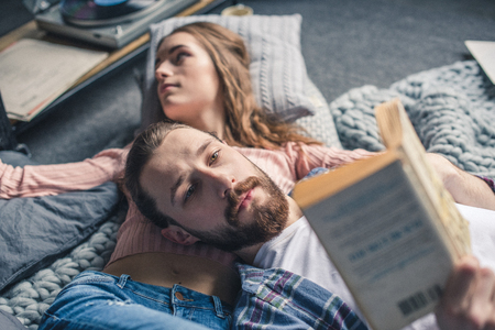 Couple reading bookの写真素材