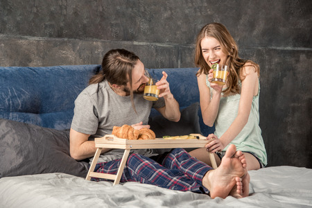Couple has breakfast in bed