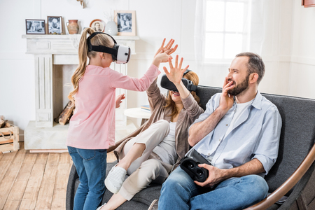 Family in virtual reality headsetsの写真素材