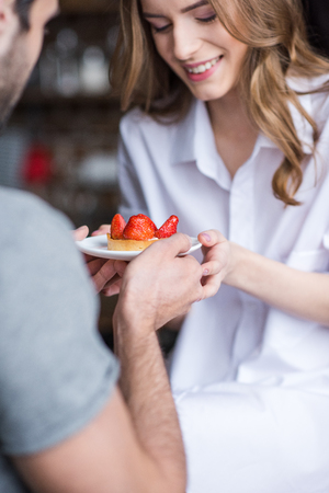 Couple with strawberry cakeの写真素材
