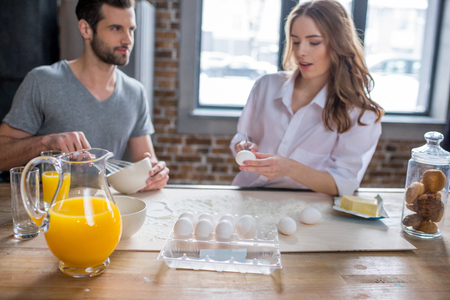 Couple cooking togetherの写真素材