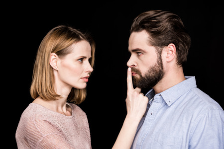 Woman asking man for quietの写真素材