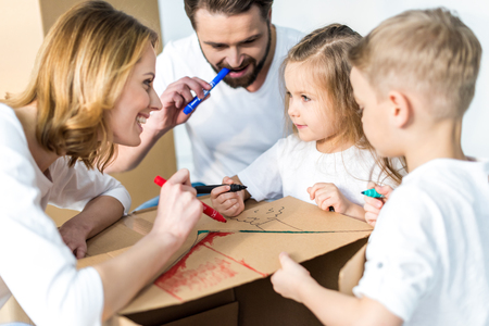 Family drawing on cardboard boxの写真素材