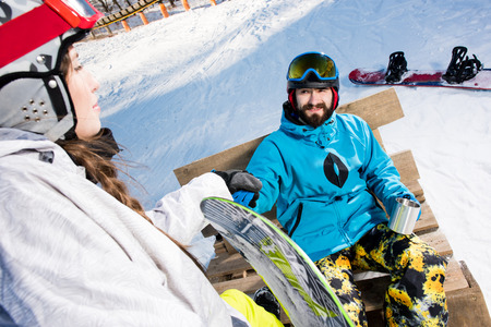 Young couple of snowboardersの写真素材