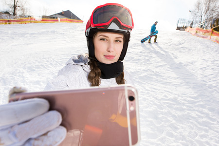 Snowboarder taking selfieの写真素材