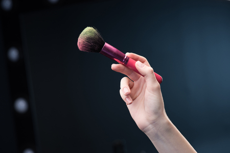 Make-up brush in handの写真素材