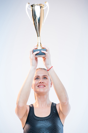 woman holding trophyの写真素材