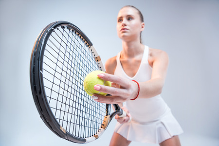 Young woman playing tennisの写真素材