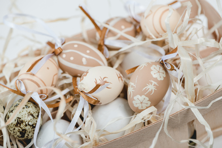 Close-up view of decorative painted easter eggs in boxの写真素材