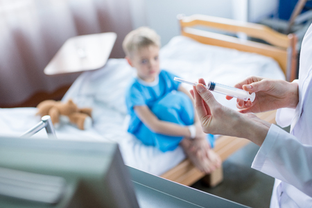 Doctor holding syringeの写真素材