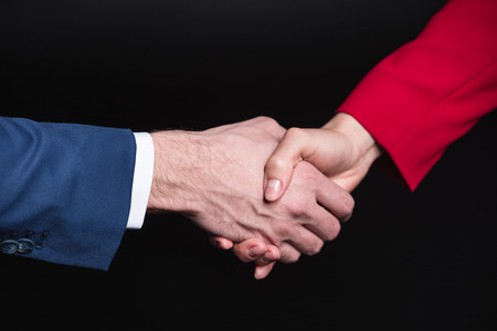 Man and woman shaking handsの写真素材