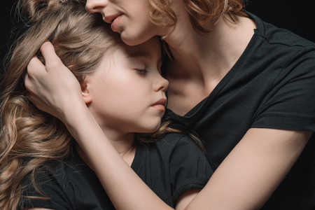 portrait of stylish daughter and mother huggingの写真素材