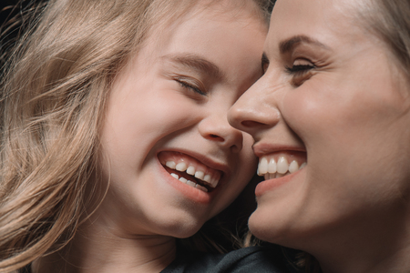 portrait of daughter and mother laughingの写真素材