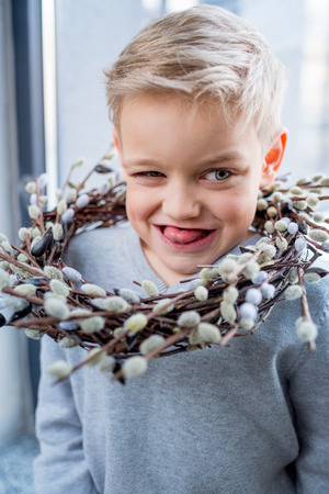 Boy with catkins wreathの写真素材