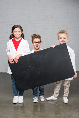 Kids holding blackboardの写真素材