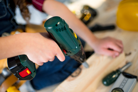 Girl drilling plankの写真素材