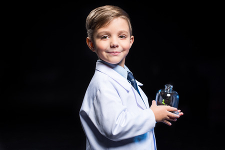Little boy holding plantの写真素材