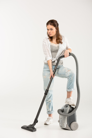 Woman with vacuum cleanerの写真素材