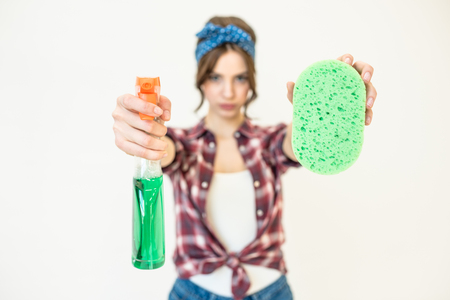 Woman with spray bottle and spongeの写真素材