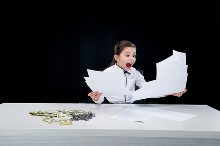 Girl working with documents at workplaceの写真素材