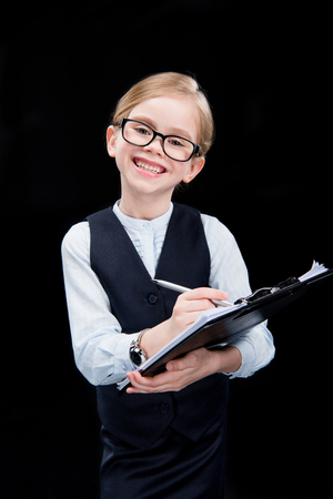 Smiling adorable girl with folderの写真素材
