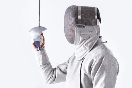 side view of fencer in uniform holding rapier in hand