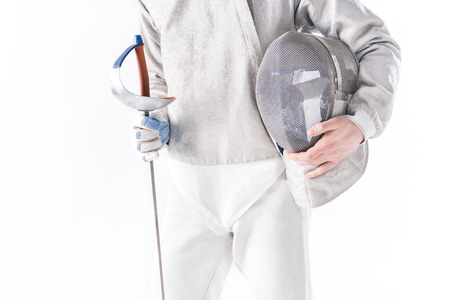 partial view of fencer holding rapier and mask in handsの写真素材