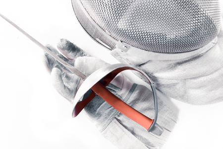 Professional fencing equipment, mask, glove and rapier isolated