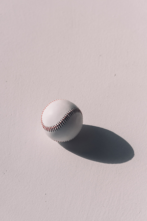 baseball ball with shadow on grey backgroundの写真素材
